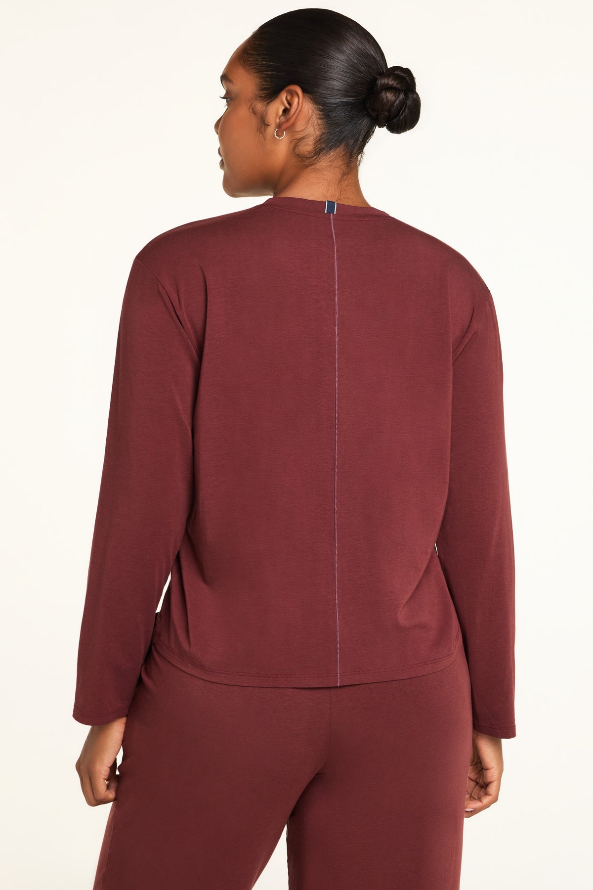 Side on-model view of the Cloud Cotton Long Sleeve T-Shirt in Cabernet paired with the Cloud Cotton Pant in Cabernet.