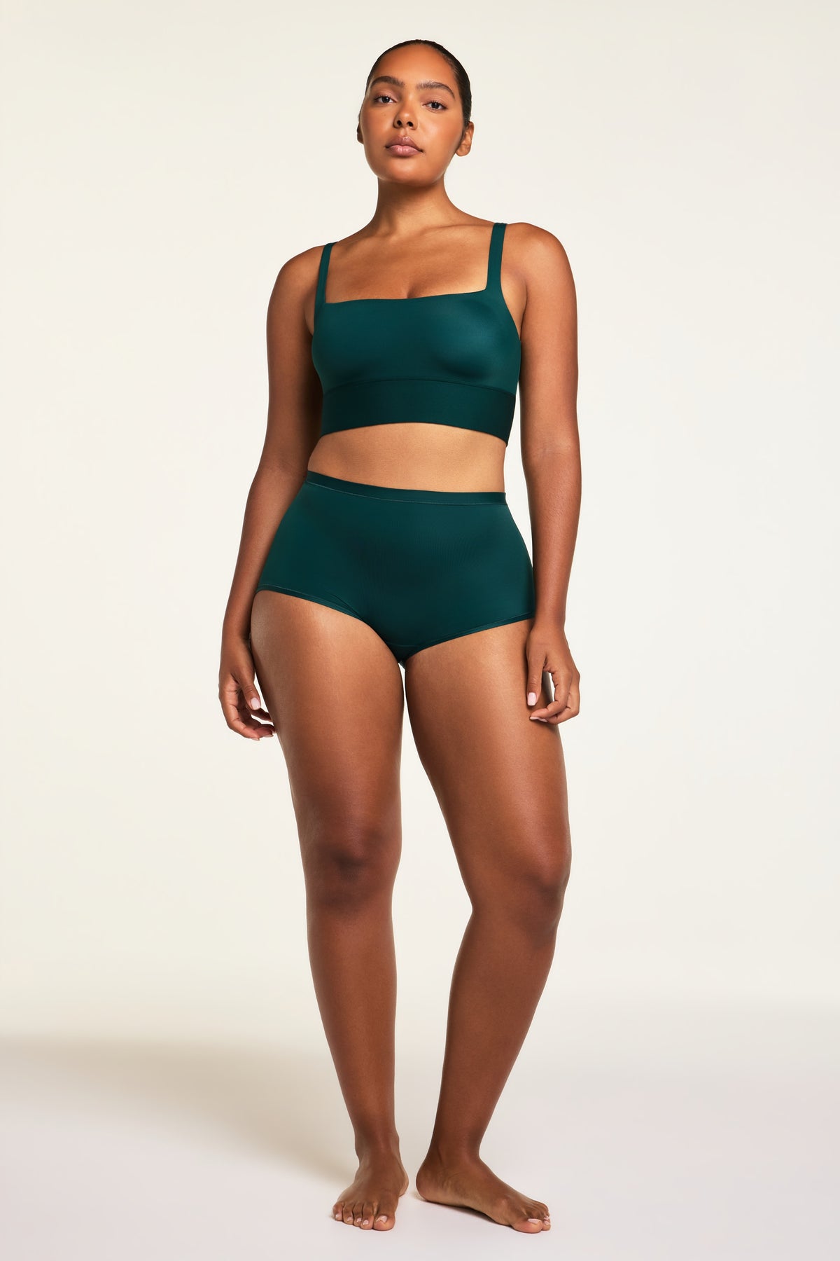 Three-quarter back view of the Bliss Boyshort in Pine paired with the Bliss Square Neck Bralette in Pine.