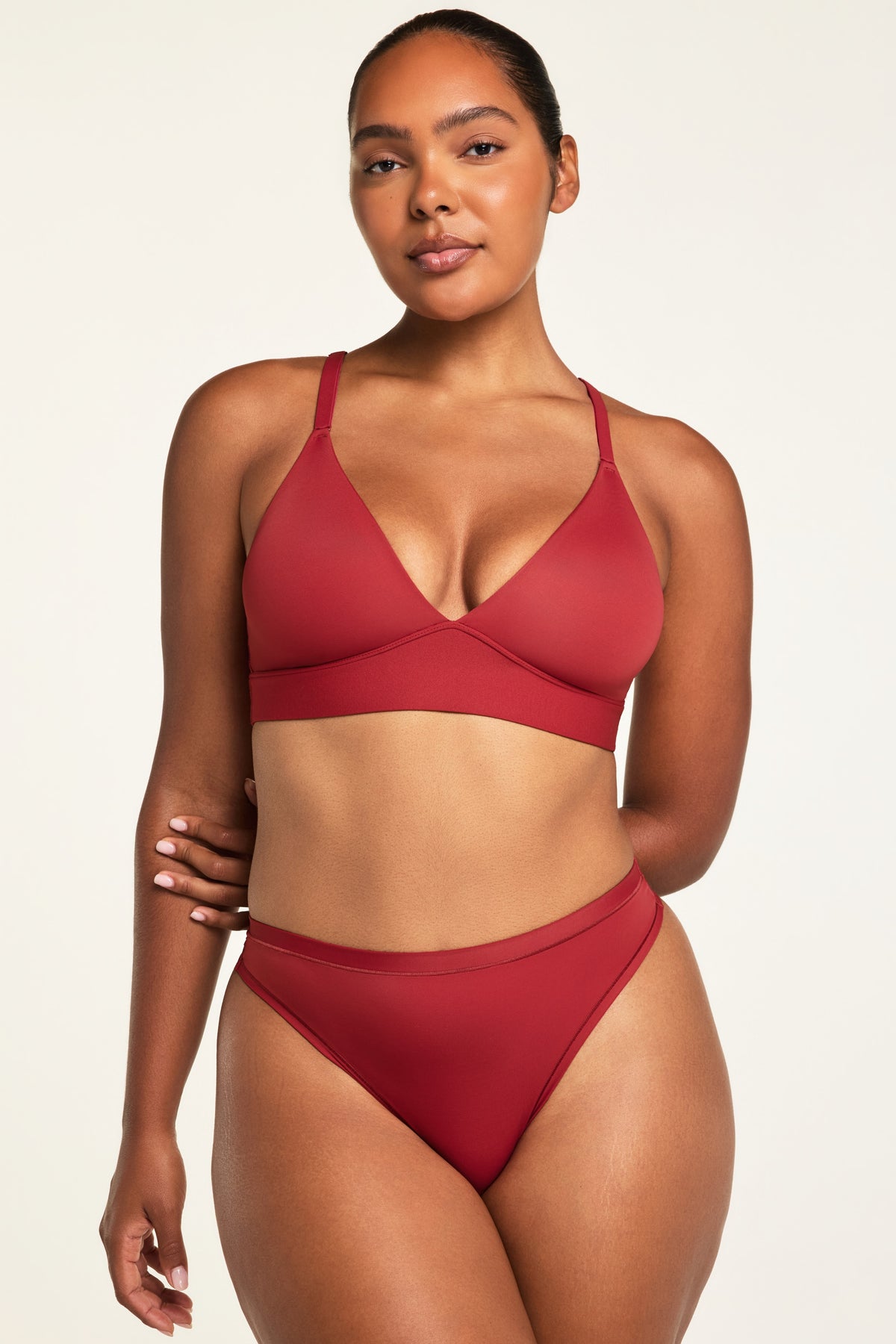 Back on-model view of the Bliss Triangle Bralette in Ruby paired with the Bliss Thong in Ruby.