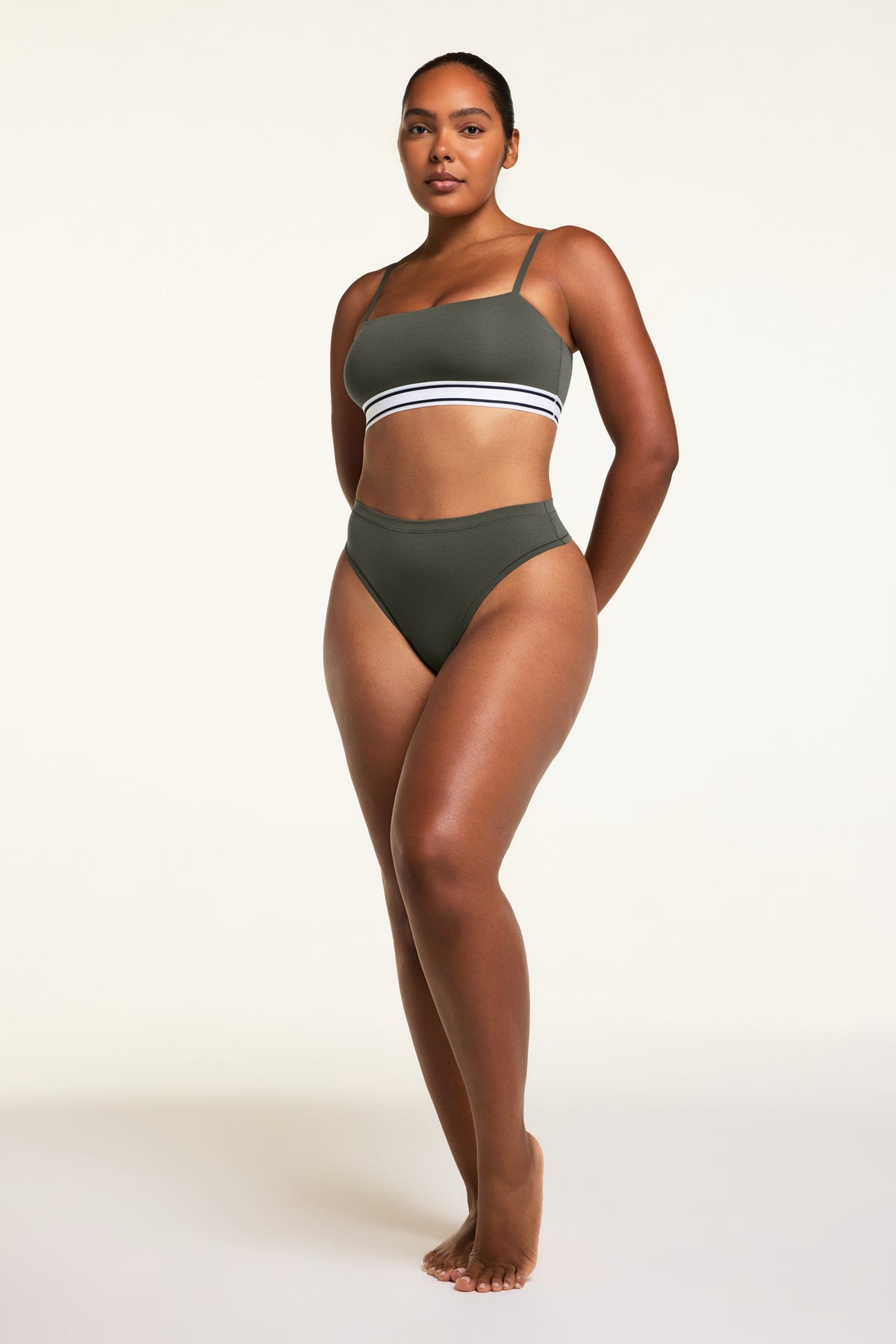Close-up detail of the Cloud Cotton Highwaist Thong in Olive paired with the Cloud Cotton Bandeau Bralette in Olive.