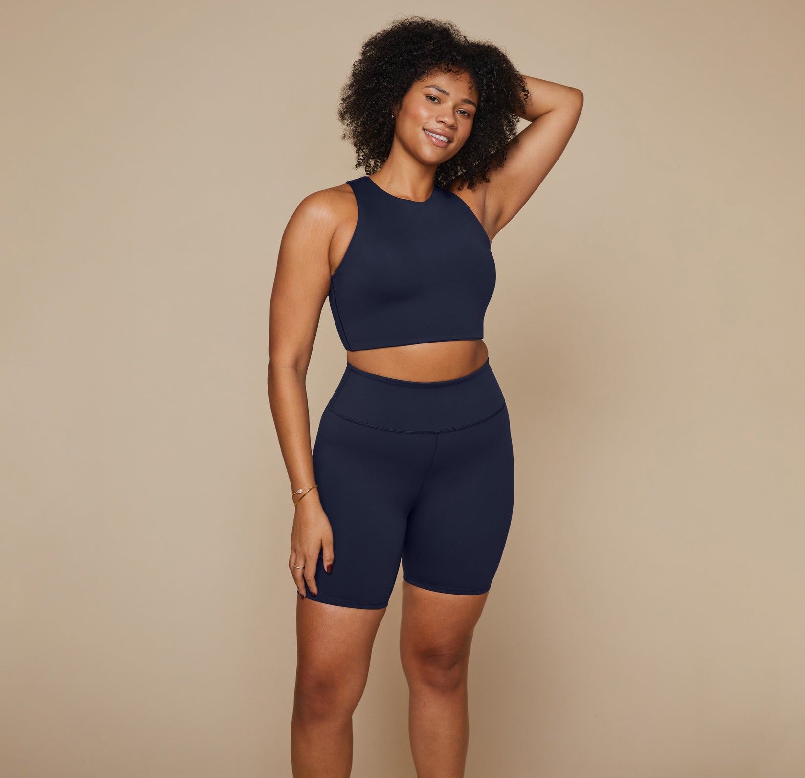 Model wearing the Flex Racerback Tank in the color Ink with the matching Flex High Rise Bikeshort.