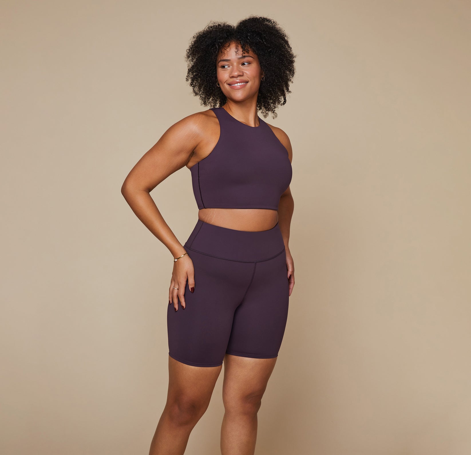 Model wearing the Flex Racerback Tank in the color Mulberry with the matching Flex High Rise Bikeshort.