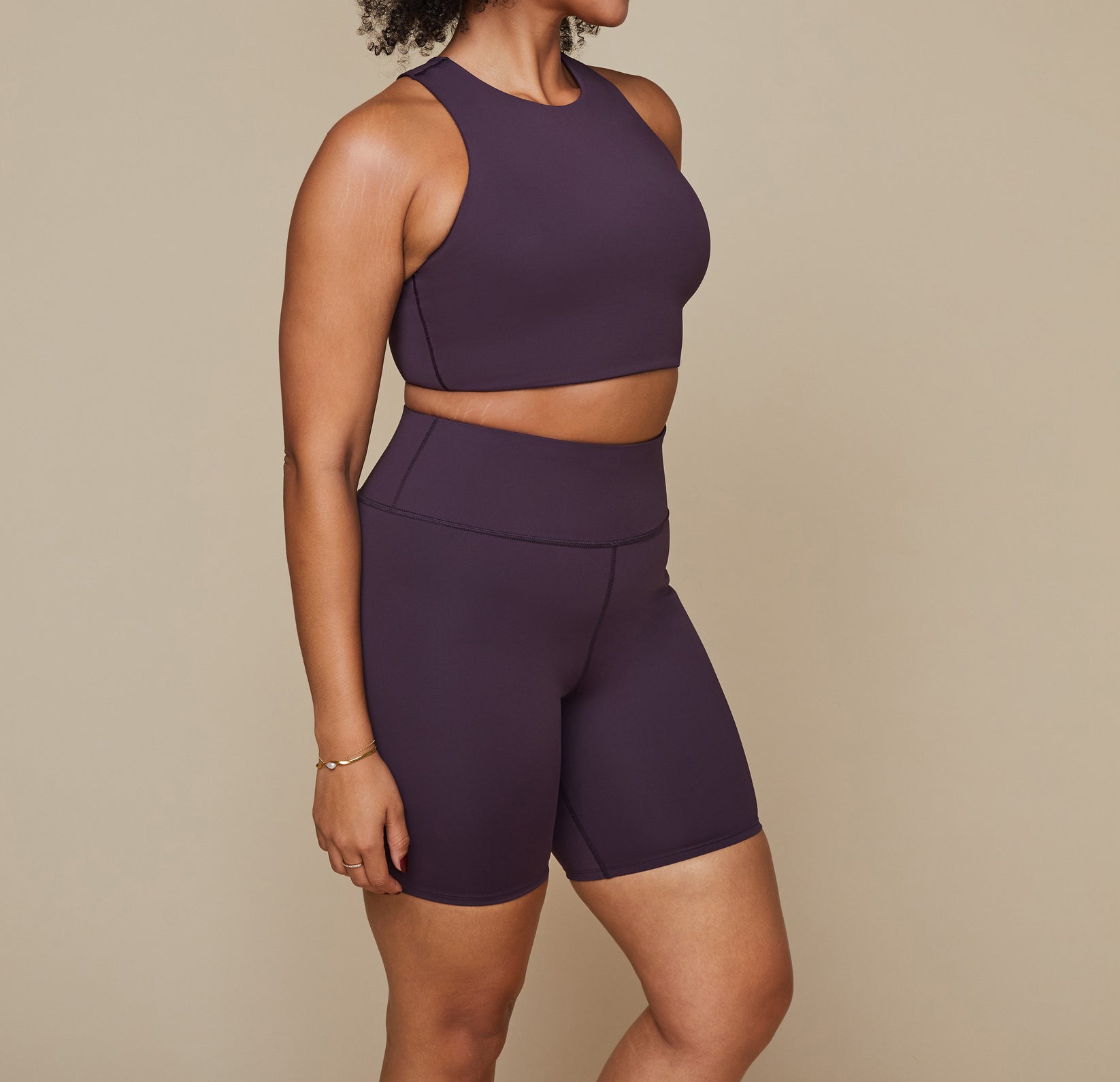Model wearing the Flex Racerback Tank in the color Mulberry with the matching Flex High Rise Bikeshort.
