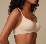 A close-up of the Base Wirefree Bra in Beige, focusing on the seamless design and comfortable fit with no digging or bulk.