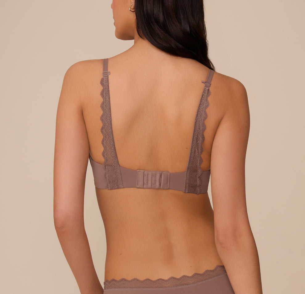 Marcela shown from the back in the Base Lace T-Shirt Bra in Mauve. The image displays the lace-trimmed adjustable straps and hook-and-eye closure, with convertible J-hook feature.