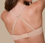 Gracie turns to show the back of the Base T-Shirt Bra in Beige with the straps converted into a racerback using the J-hook for extra support and versatility.