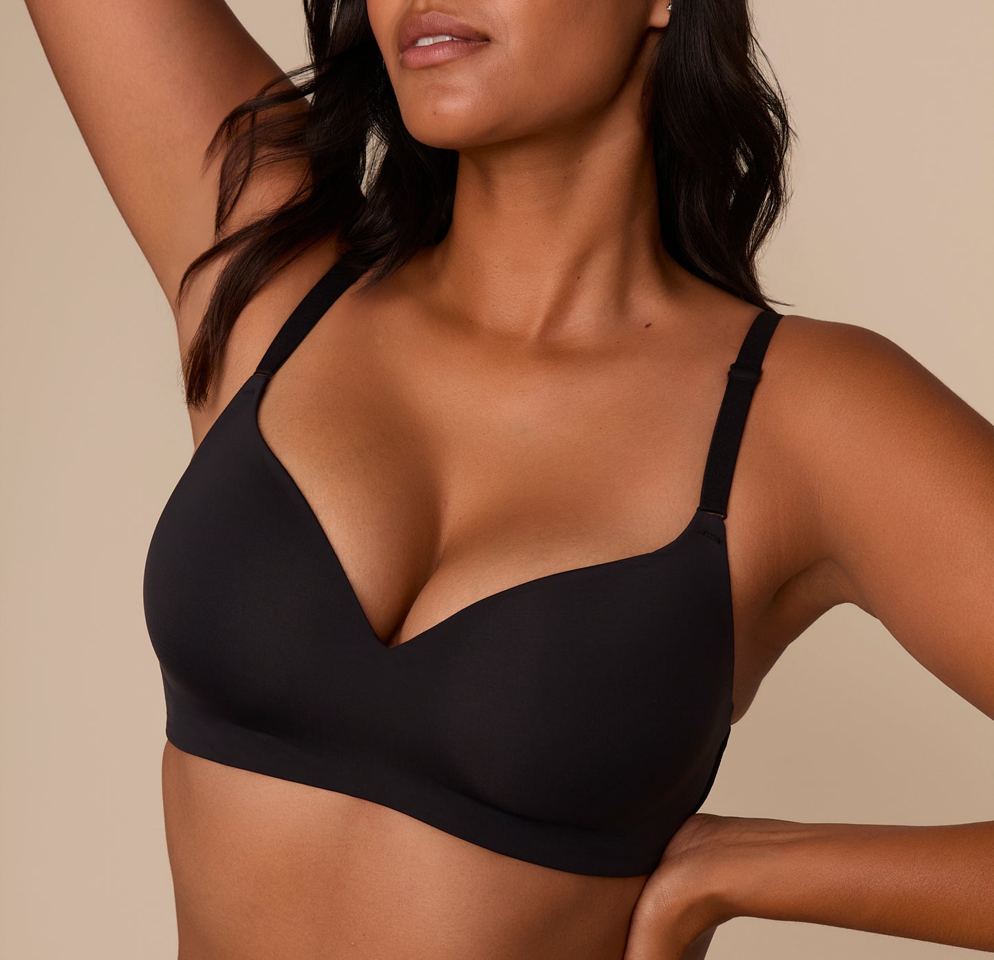 Close-up of Victoria in the Base Wirefree T-Shirt Bra in Black, showcasing the soft, lightly lined cups and V-neckline for a natural shape without wires.
