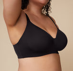 A closer view of the Base Wirefree Bra in Black, focusing on the seamless transition between the molded cups and the band for a smooth silhouette under clothing.