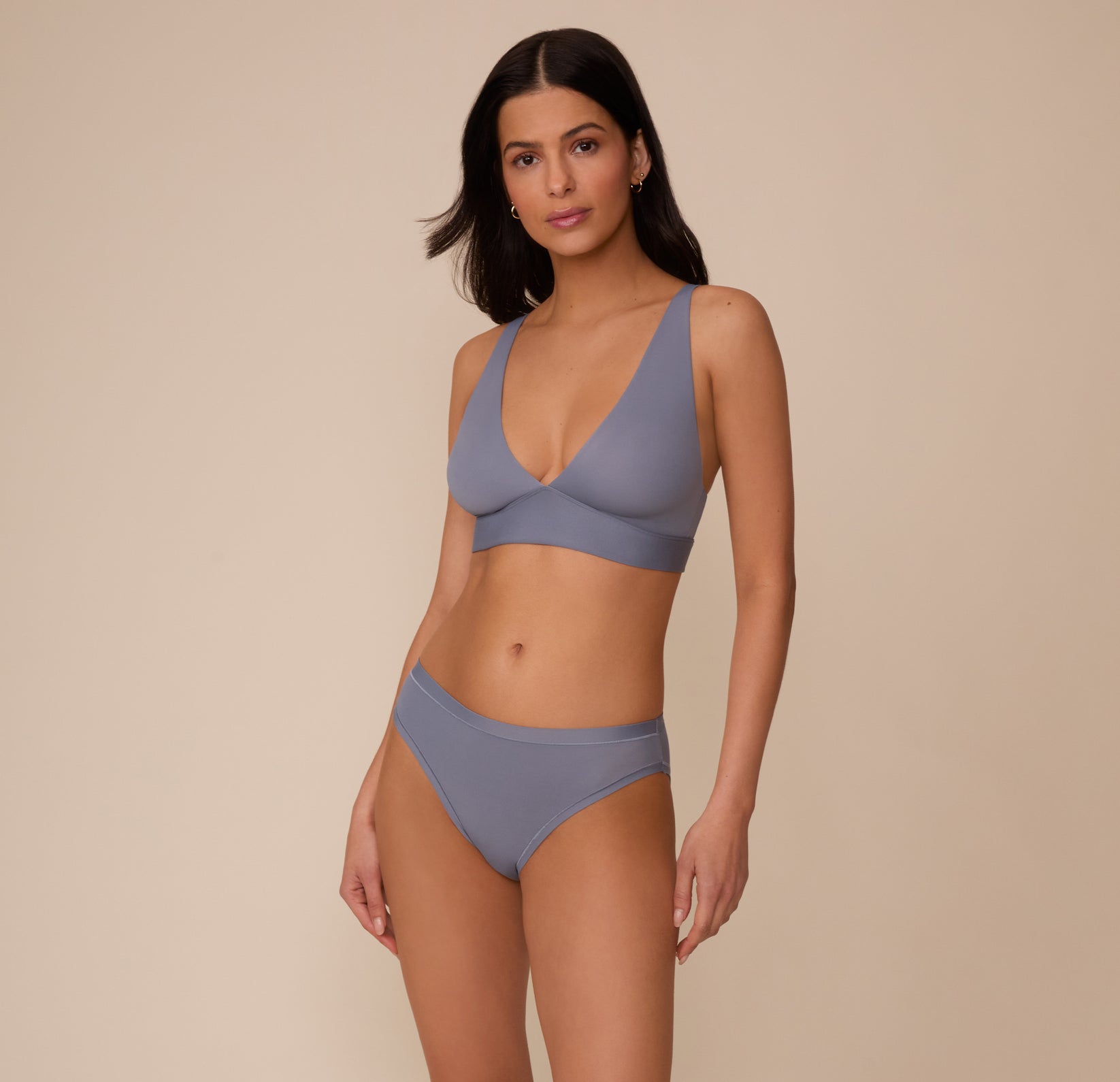 Full front view of Marcela wearing the Bliss Plunge Adjustable Bralette and Bliss Bikini in Steel. The image showcases the full set with a soft, supportive design ideal for everyday wear.