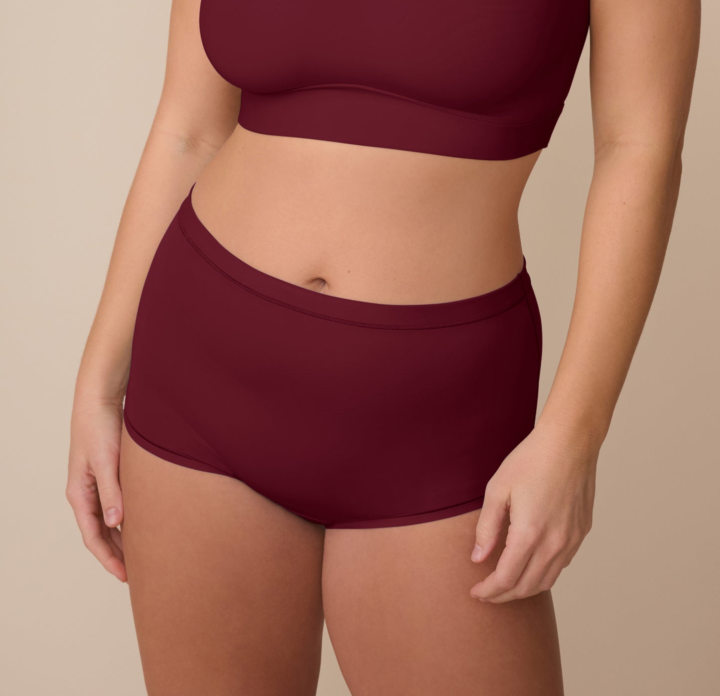Sonnie wearing the Bliss Boyshort in Bordeaux. The mid-rise boyshort offers full coverage and a smooth, supportive waistband. sizing: Sonnie wears size Large