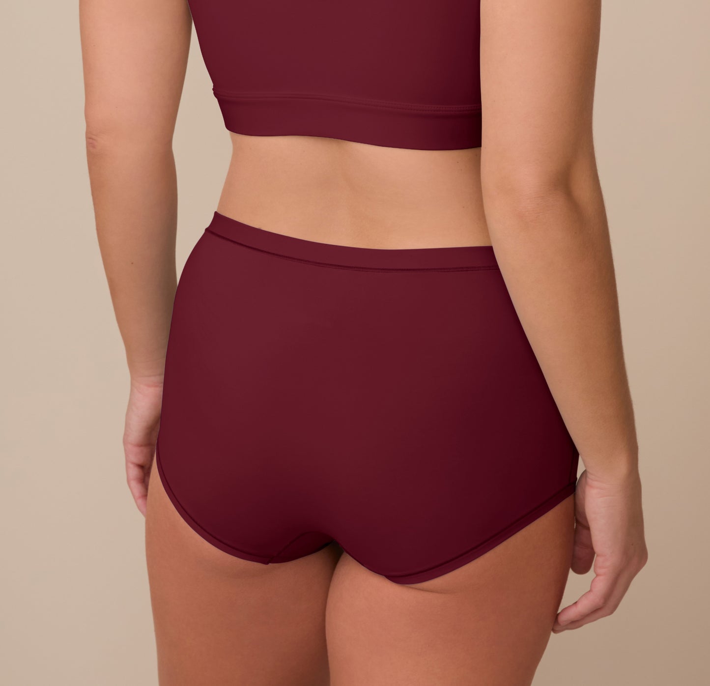 Sonnie shown from behind in the Bliss Boyshort in Bordeaux, highlighting the seamless back and contoured full-coverage fit.
