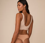 Back view of Victoria in the Bliss Bralette in Beige. The scoop back design sits comfortably against the skin with no wires and no fuss.
