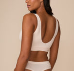 Rear view of Victoria in the Bliss Bralette, highlighting the deep scoop back and smooth, tag-free finish for maximum comfort.