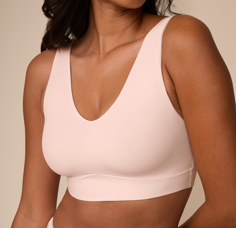Close-up of Victoria wearing the Bliss Bralette in Rose. The image zooms in on the neckline and subtle shaping of the cups, showcasing the comfort-first design.