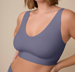 Close-up of Sonnie in the Bliss Bralette in Steel. The image highlights the subtle shaping, wide straps, and smooth underband.
