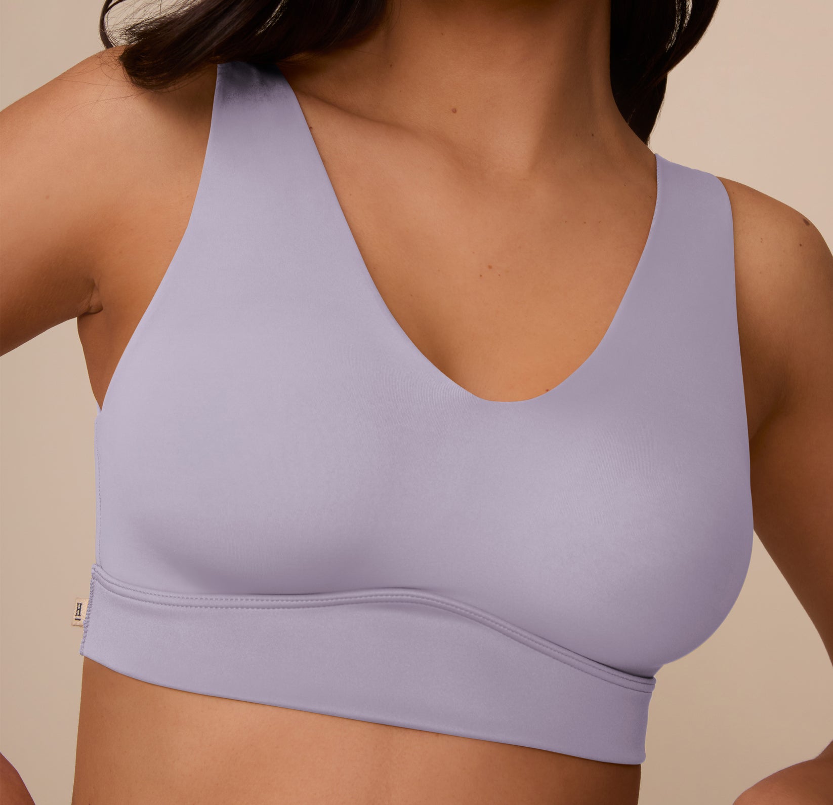Close-up of Marcela wearing the Bliss Bralette in Violet, focusing on the bralette’s scoop neckline, molded cups, and smooth underband. The close detail emphasizes the soft stretch fabric and clean construction.