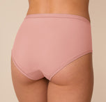 Close-up of the back of Freya in the Bliss Highwaist Brief in Dusty Rose, focusing on the soft fabric and no-dig edges.