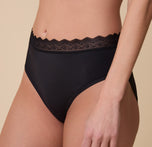 Close-up of the Bliss Lace Highwaist Brief in Black on Gracie, showcasing the intricate lace waistband and smooth, stretchy fabric for a barely-there feel.