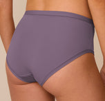 Back close-up of the Bliss Highwaist Brief in Eclipse worn by Freya, emphasizing the soft, stretchy fabric and full-coverage design with clean stitching for a polished, invisible look.