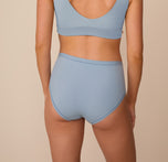 Back view of Freya in the Bliss Highwaist Brief in Glacier. The image highlights the smooth, full-coverage fit and comfortable edges across the hips and back.