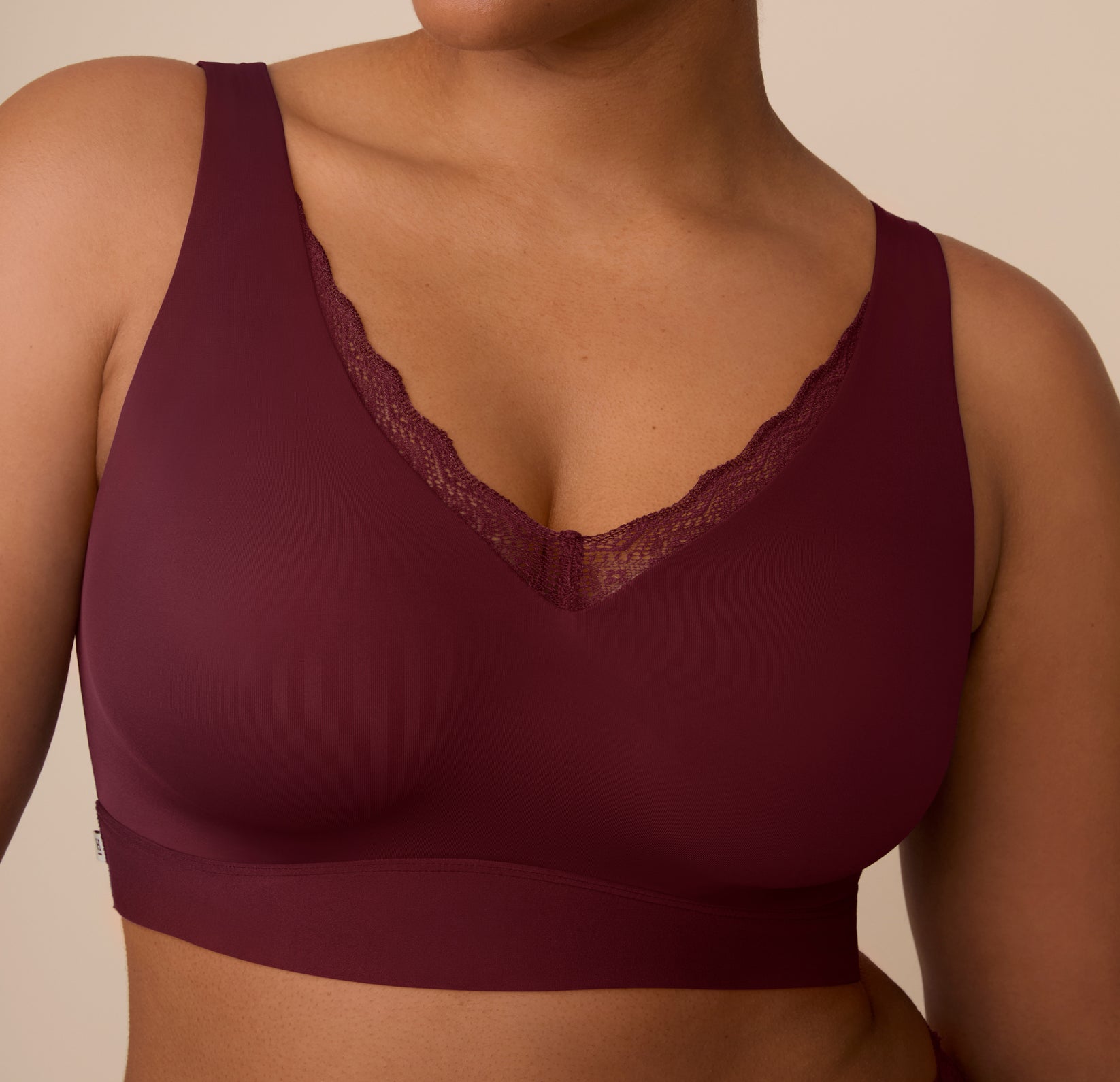 Detailed close-up of the Bliss Lace Bralette in Bordeaux, focusing on the soft lace neckline and wire-free construction.