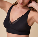 A detailed close-up of the Bliss Lace Bralette in Black, focusing on the delicate lace trim along the neckline and the smooth, supportive fit.