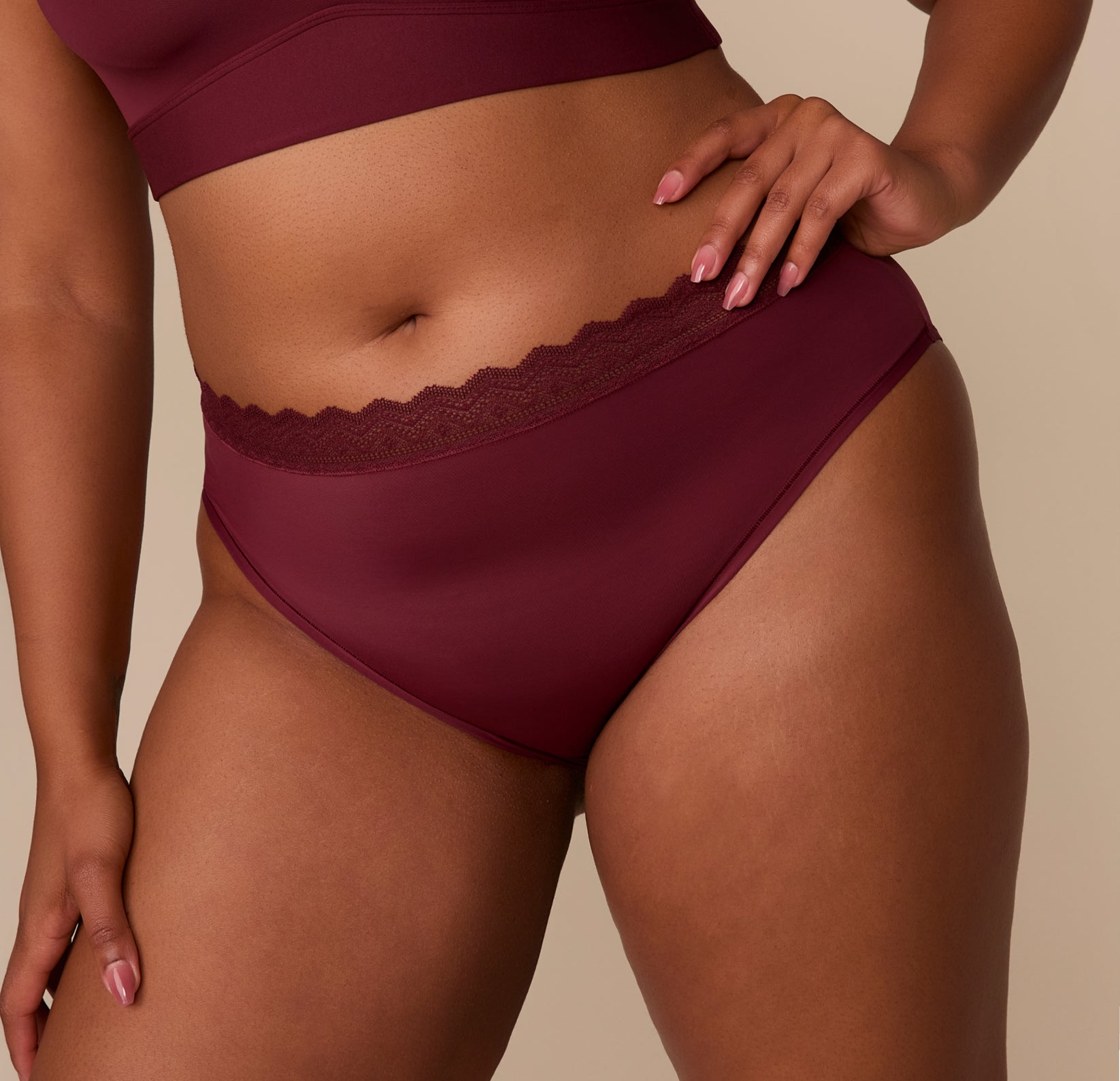 Close-up of the Bliss Lace Highwaist Brief’s front waistband in Bordeaux. The image emphasizes the delicate lace detailing and soft, flexible fabric.
