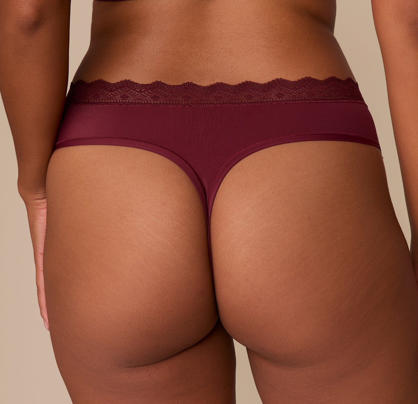 Close-up of the back waistband and thong cut on the Bliss Lace Highwaist Thong in Bordeaux, highlighting the stretchy lace detail and comfortable fit across the hips.