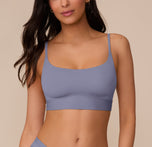 Marcela wears the Bliss Scoop Bralette in Steel, shown from a front angle. The soft microfiber fabric and clean neckline offer everyday comfort. sizing: Marcela wears size Small