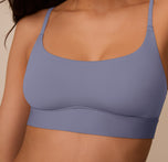 Marcela wears the Bliss Scoop Bralette in Steel, shown from a close up front angle. The soft microfiber fabric and clean neckline offer everyday comfort.