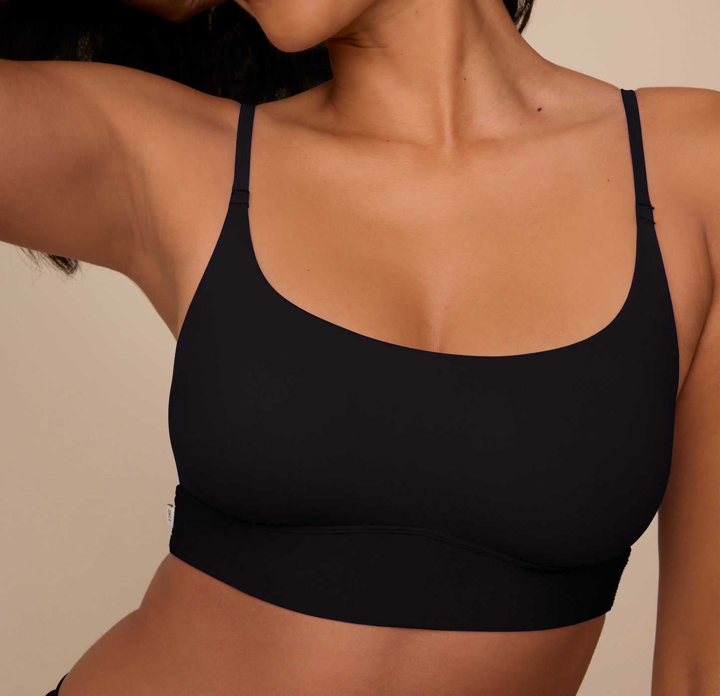 Detail shot of the Bliss Scoop Bralette in Black on Victoria, highlighting the soft fabric and supportive scoop neckline.