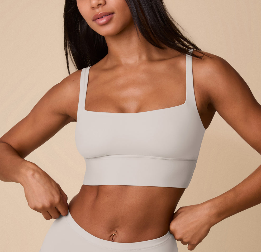 Close-up front view of Ally wearing the Bliss Square Neck Bralette in Frost. The image highlights the bralette’s clean square neckline, wide straps, and supportive band, emphasizing its ultra-soft, wireless construction. sizing: Ally wears size Small