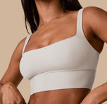Close-up side angle of Ally in the Bliss Square Neck Bralette in Frost, showcasing the curve-hugging fit, wide straps, and buttery-smooth microfiber fabric.