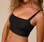 A zoomed-in shot of the Bliss Square Neck Bralette in Black, focusing on the soft, lightweight fabric, square neckline, and seamless construction.