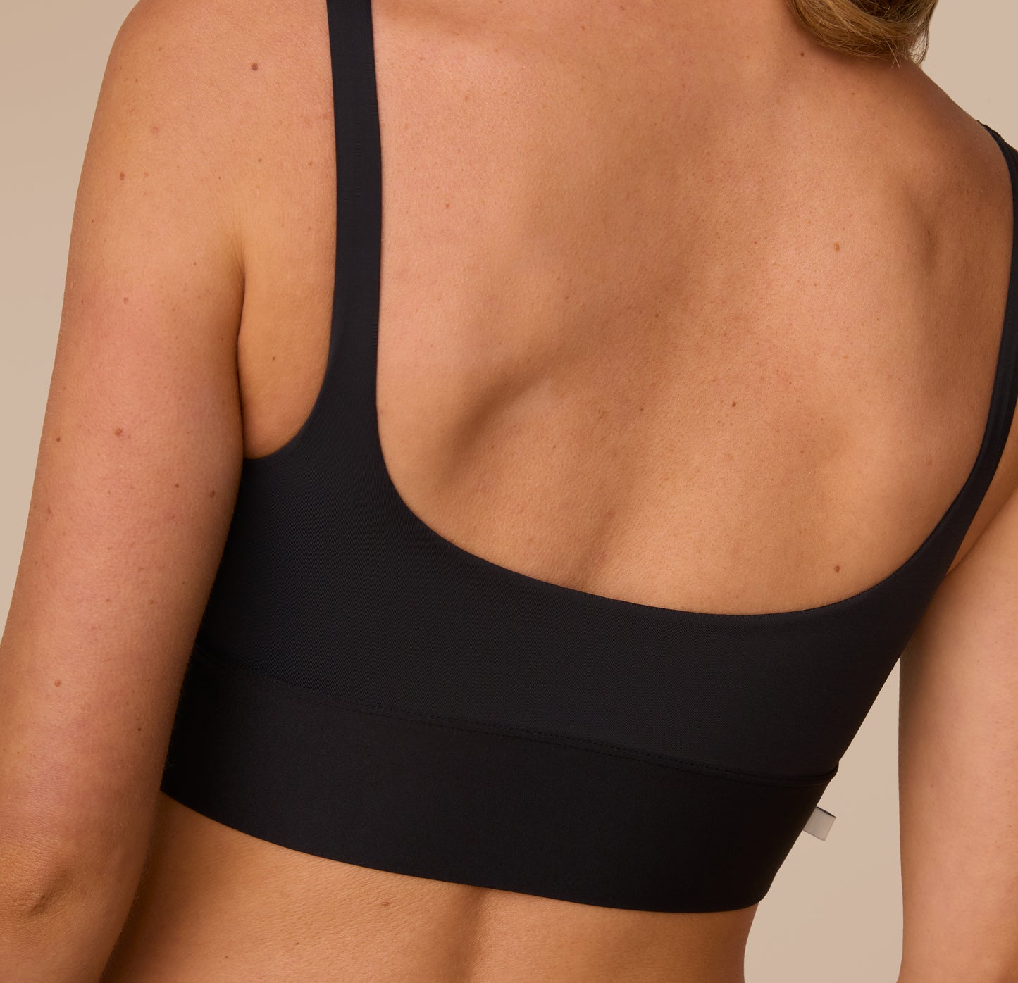 A detailed back view of the Bliss Square Neck Bralette in Black, highlighting the scoop-back and no-dig, wireless support.
