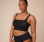 Zarria wears the Bliss Square Neck Bralette in Black with matching Bliss Highwaist Brief, showcasing the smoothing design and breathable, second-skin comfort. sizing: Zarria wears size XL