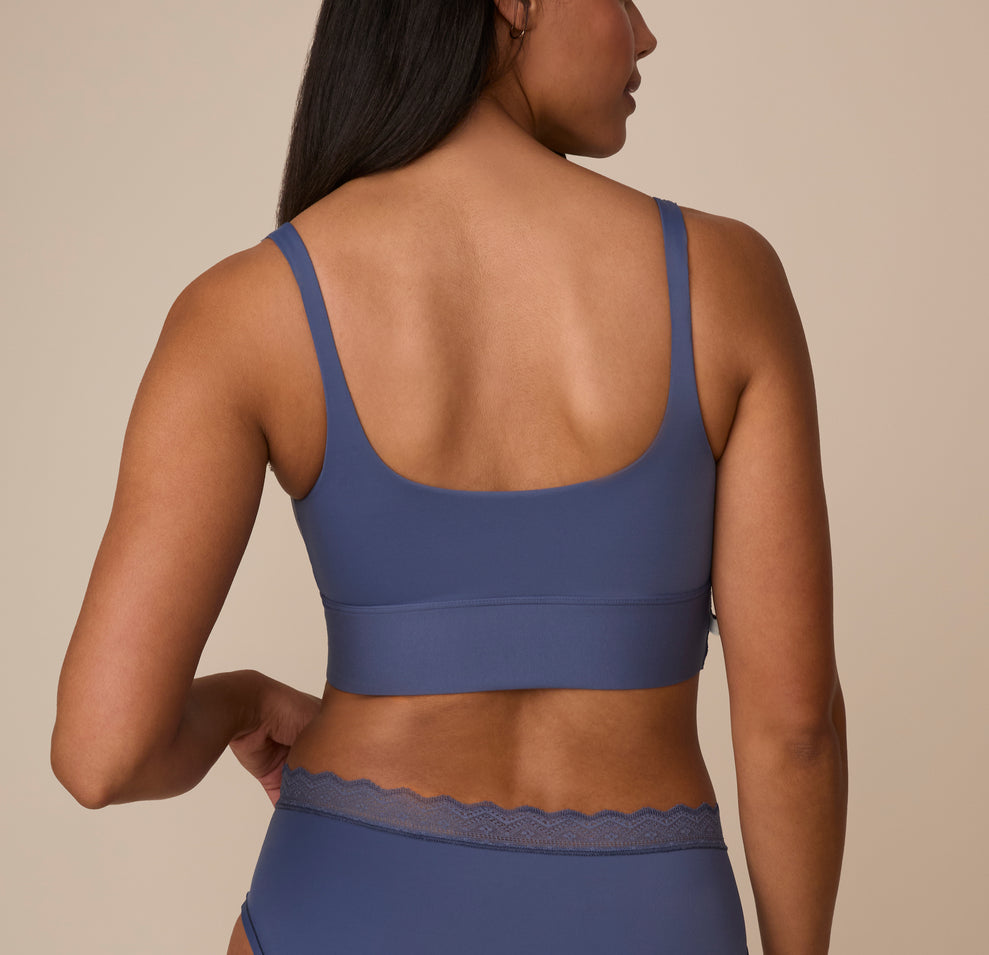 Back view of Nemesis in the Bliss Square Neck Bralette in Twilight. The wide back band and scoop back design highlight a smooth, comfortable fit.