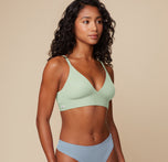 Three-quarter side view of Ally wearing the Bliss Triangle Bralette in Dew, showing the clean lines and breathable microfiber fabric.