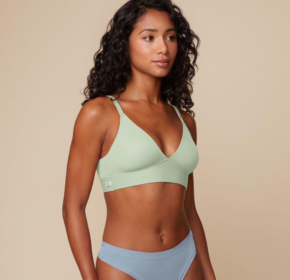 Three-quarter side view of Ally wearing the Bliss Triangle Bralette in Dew, showing the clean lines and breathable microfiber fabric.