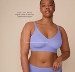Zarria wearing the Bliss Triangle Bralette in Dusk, annotated with sizing detail. Text on the image notes that sizes L–6XL feature a higher center in front for added support. sizing: Zarria wears size 2XL