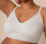 Close-up of Zarria wearing the Bliss Triangle Bralette in Frost, annotated with sizing detail. Text on the image notes that sizes L–6XL feature a higher center in front for added support.