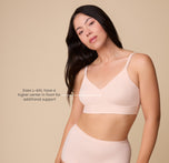 Emersyn models the Bliss Triangle Bralette in Rose, with a text overlay indicating that sizes L–6XL have a higher center for additional support. sizing: Emersyn wears size Large