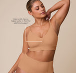 India wearing the Bliss Triangle Bralette in Tan, highlighting a fit designed for sizes L-6XL, featuring a slightly higher center front for added support. sizing: India wears size Large