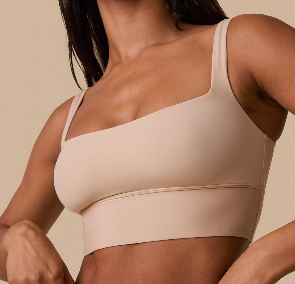 A zoomed-in view of the Bliss Square Neck Bralette in Beige on Ally, emphasizing the soft, second-skin feel of the fabric and the structured yet flexible support.