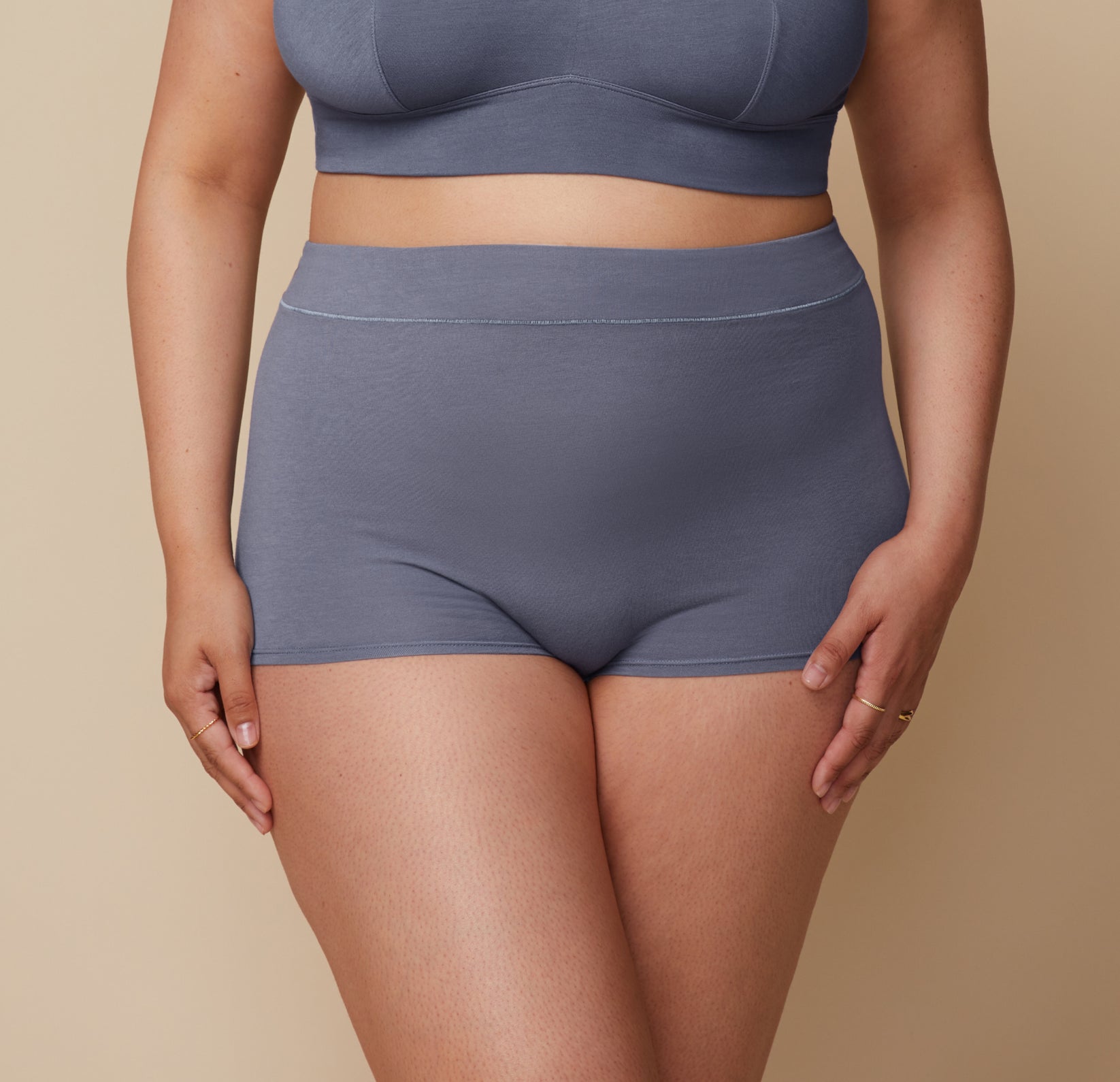 Close-up of Bianca’s midsection, showcasing the fit of the Cloud Cotton Boyshort in Slate. The image focuses on the waistband and fabric texture.