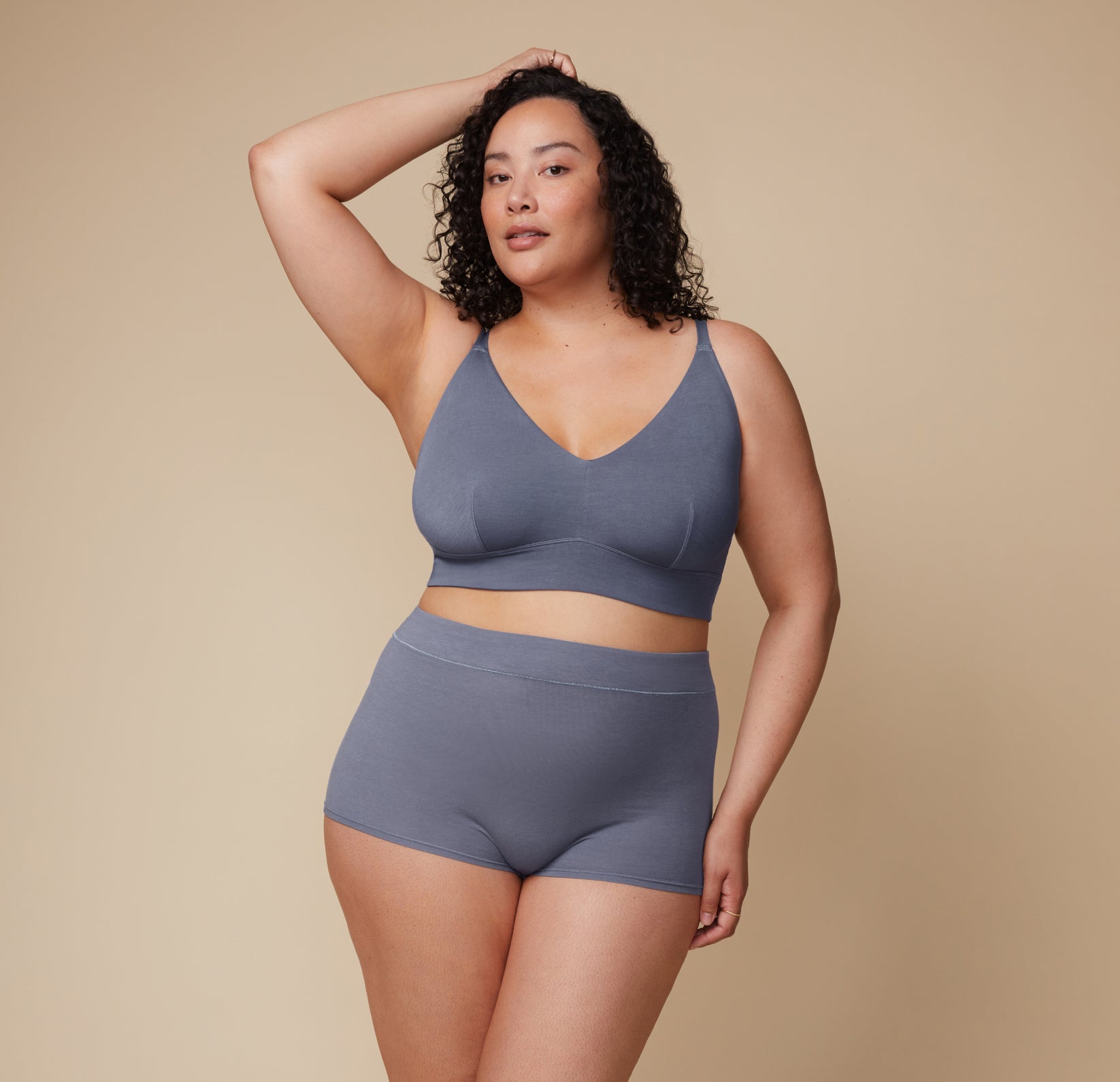 Full-body view of Bianca standing confidently in the Cloud Cotton Triangle Bralette and Highwaist Boyshort in Slate.