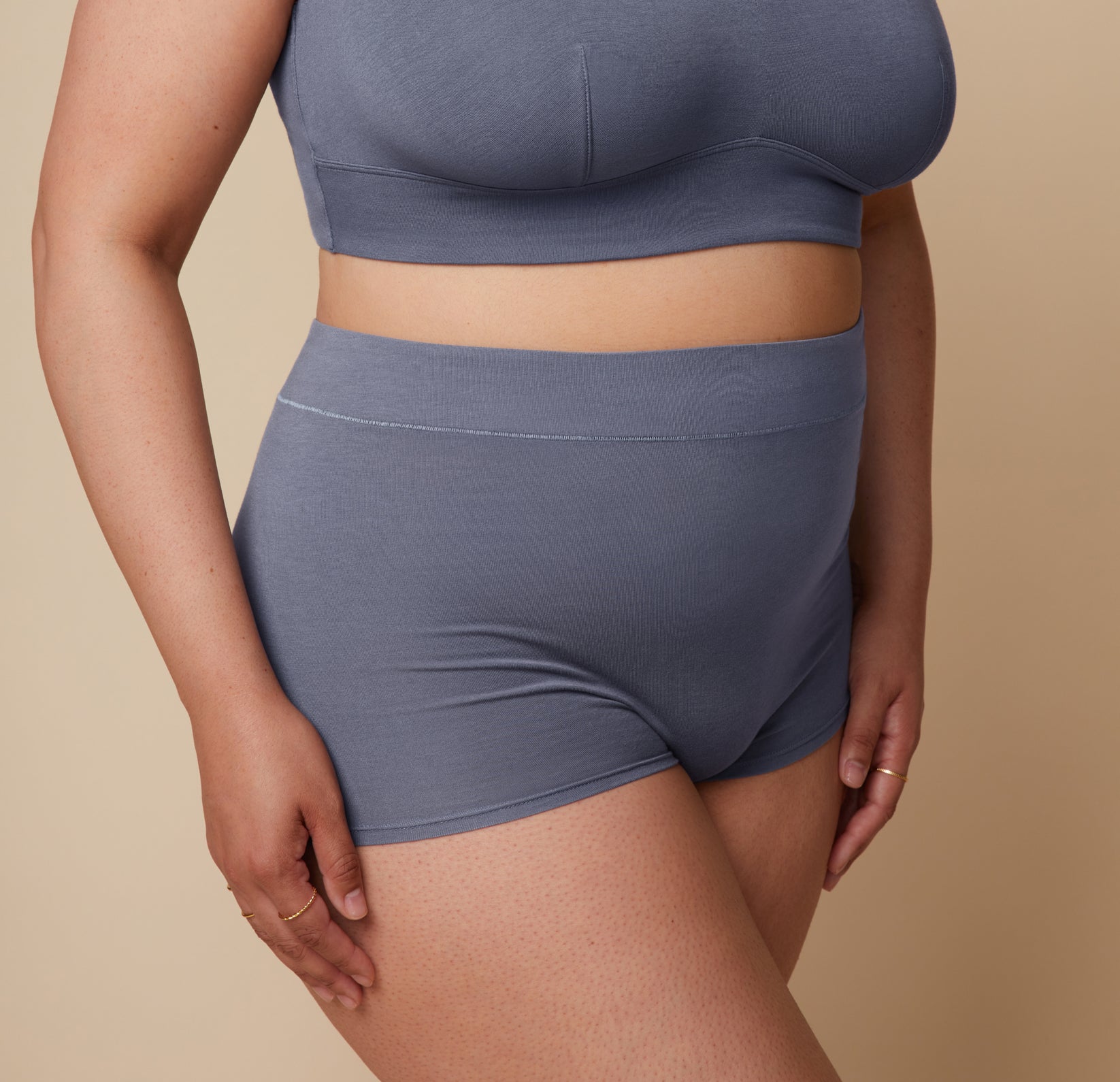 Close-up of Bianca’s midsection, showcasing the fit of the Cloud Cotton Highwaist Boyshort in Slate. The image focuses on the waistband and fabric texture.
