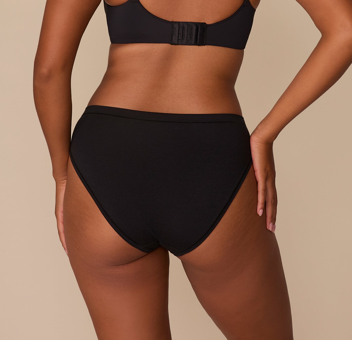 Rear view of Victoria in the Cloud Cotton French Cut Brief in Black, highlighting the full back coverage and soft, stretchy cotton fabric that hugs the body without digging in.