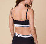 The back view of Gracie in the Cloud Cotton Retro Bandeau Bralette in Black, showing the comfortable fit and thin, adjustable straps.