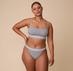 India stands confidently in the Cloud Cotton Retro Bandeau Bralette in Heather Charcoal, paired with the matching Cloud Cotton French Cut Brief, showcasing the comfortable, body-hugging fit.
